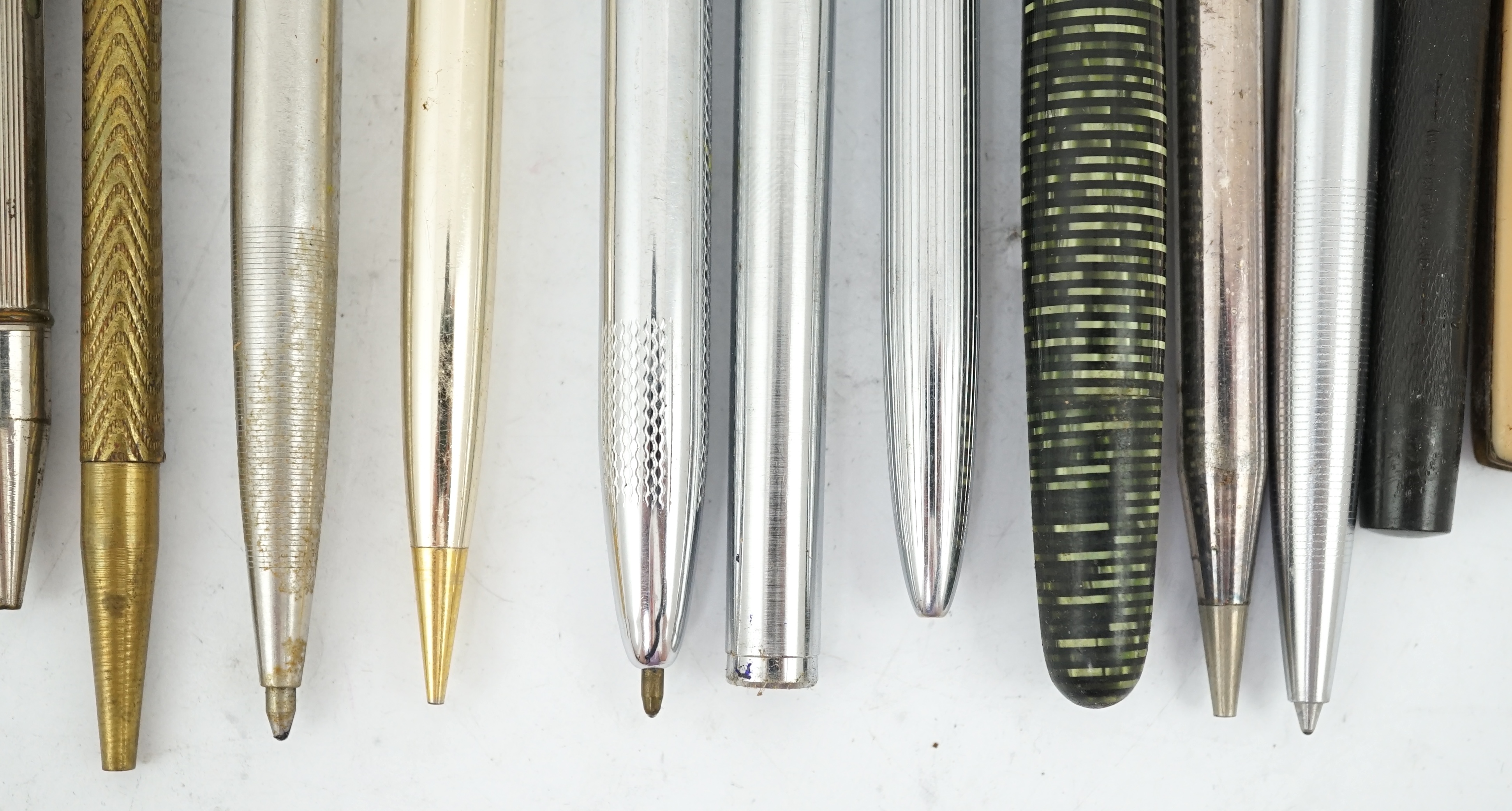 A collection of pens, pencils and stationery equipment, including a Parker Vacumatic